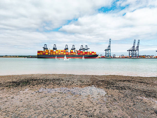 Hamburg, Germany, 2025-04-08: Frontal view of the container ship Hanoi Express in the Port of Hamburg, slightly cloudy sky, 1:1
