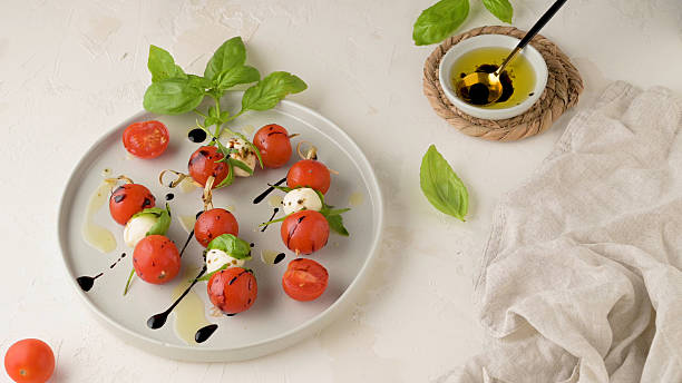 istock Caprese salad with tomato and mozzarella 2235654130