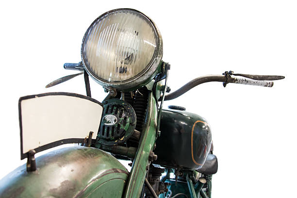 istock Old motorcycle, front view of light and handlebars, isolated on white background. Retro motorbike headlamp and handlebars close up. 2235659453
