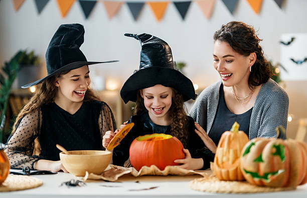 istock Happy family preparing for Halloween. 2235667298