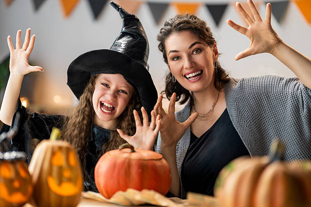 istock Happy family preparing for Halloween. 2235667303