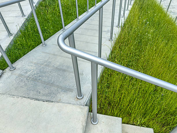 istock ramp with metal safety handrails for disabled persons in wheelchairs. helpful structure. closeup view. 2235670326
