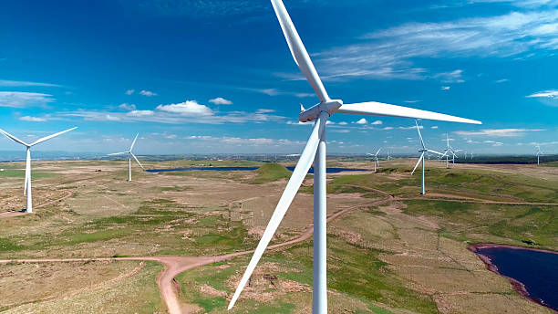 istock Wind generator in the process of generating electrical energy in a wind farm 2235674661