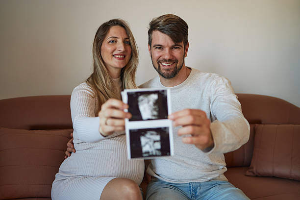 istock Young couple showing ultrasound 2235679302