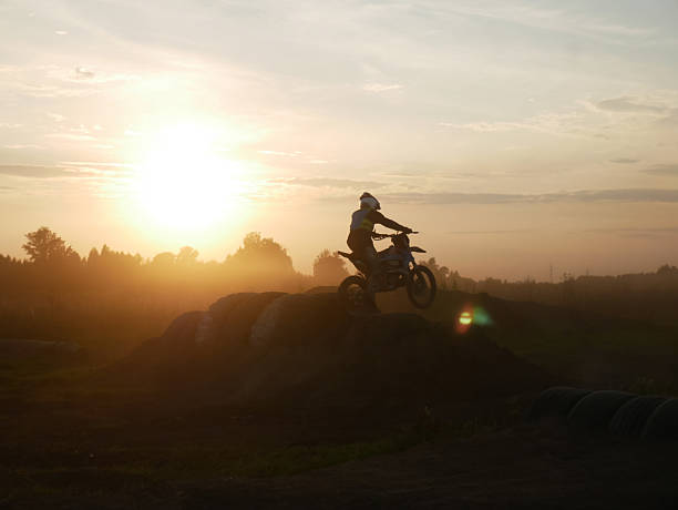 istock Motocross Rider at Sunset - Silhouette Jump 2235679361