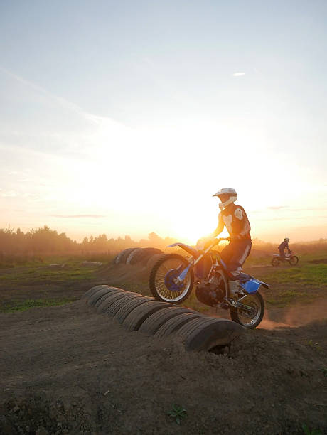 A Motocross rider riding on an extreme dust track