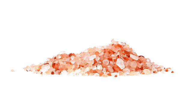 istock Himalayan pink salt pile isolated on white background 2235680676