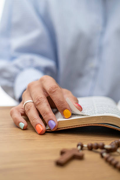 istock A woman reading the Bible at home. 2235686370