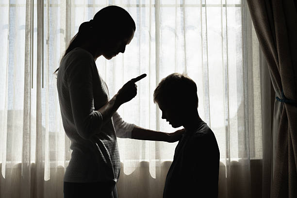 istock Mother correcting disciplining her son child for bad behavior 2235686765