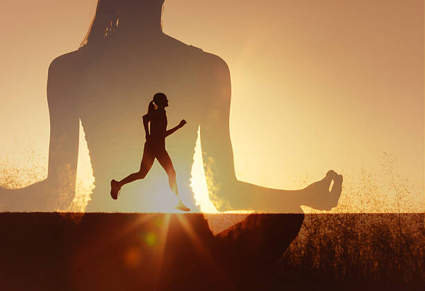istock Female runner inside meditating figure at sunrise. 2235687947