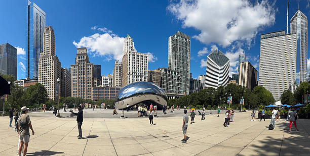 Chicago, Illinois, USA. Sep 11, 2025. A dynamic panoramic view of Chicago's Millennium Park, showcasing the iconic Cloud Gate sculpture and the city's stunning skyline under a bright, sunny sky