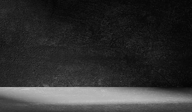 istock Dark light gray background with cement wall texture. Minimalist abstract background for product presentation with soft shadows from the window. 2235690157