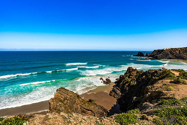 istock Empty Odeceixe beach in Portugal. Beautiful Algarve coastline. View at sandy beach and cliffs 2235691098