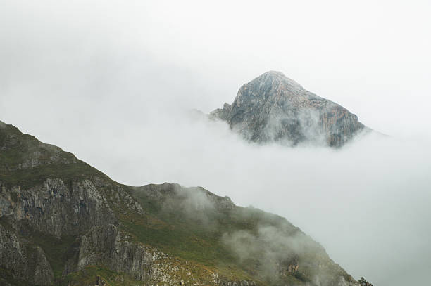Mountain peaks over fog