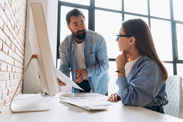 istock Business partners discussing a project in the office 2235694342