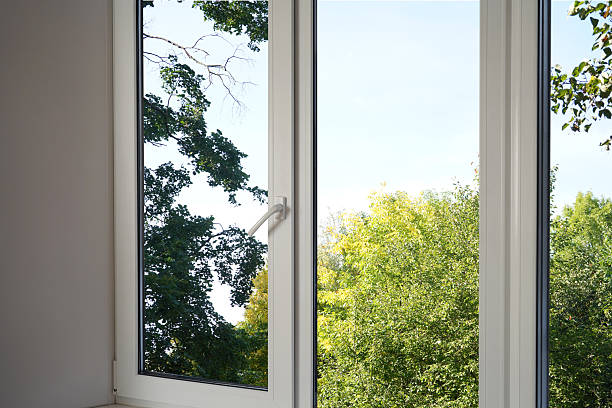 istock View from the window on the garden autumn yellow trees. 2235694375