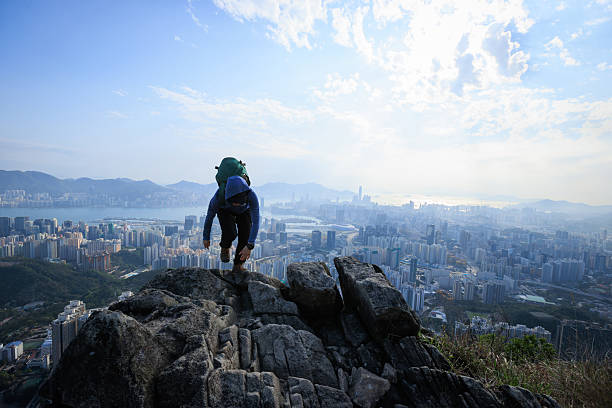 istock Climbing up on the mountain cliff edge in Hong Kong 2235694461