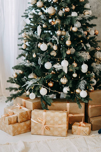 istock Decorated Christmas tree with shiny lights and ornaments. Festive holiday interior for greeting card design or seasonal advertisement. New Year mood. 2235696367