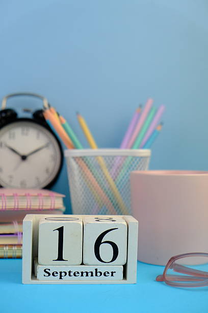 istock September 16, calendar on business office table, workplace at blue background. School concept. 2235698382