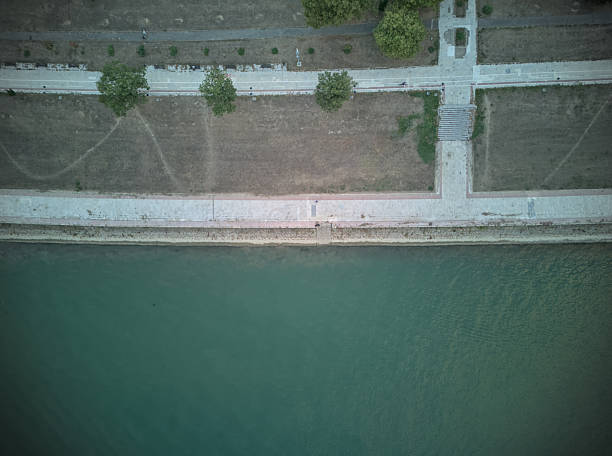 istock Riverbank walk path bird's eye aerial view 2235702996