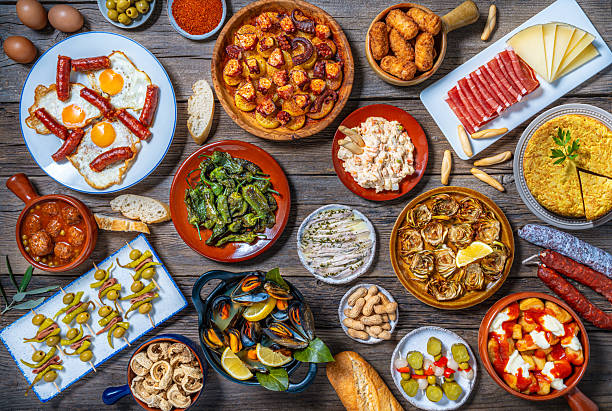 istock Assorted Tapas from Spain food, typical Spanish recipes, and pintxos on a rustic wood 2235703684