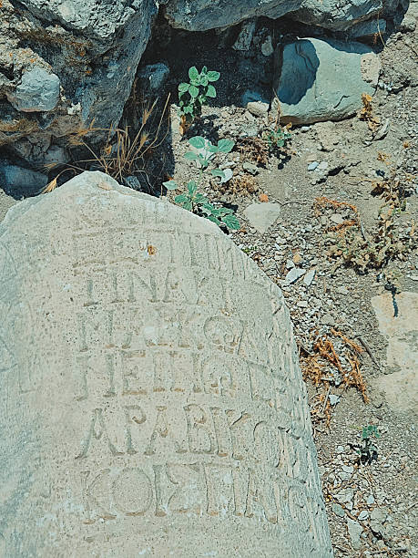 istock Vertical photo of ancient columns with Greek inscriptions 2235707992