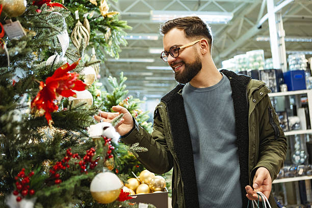 istock Happy man shopping for Christmas 2235710271