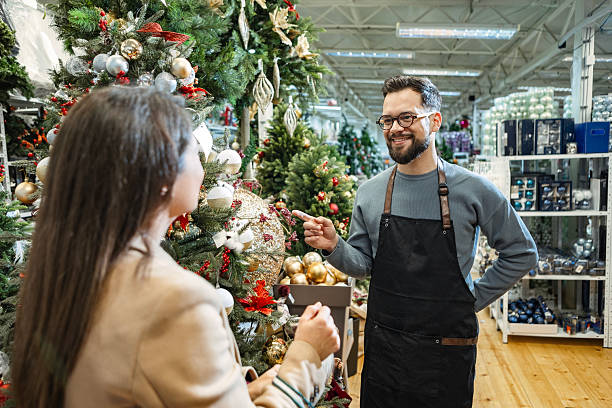 istock Woman shopping with retail staff support 2235710287