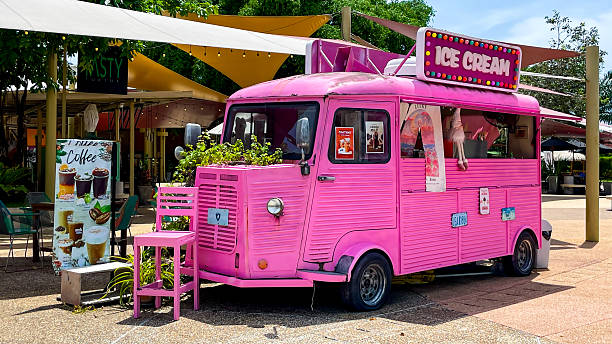 Thailand, Phuket - September 10, 2025: A pink food truck with a sign reading \
