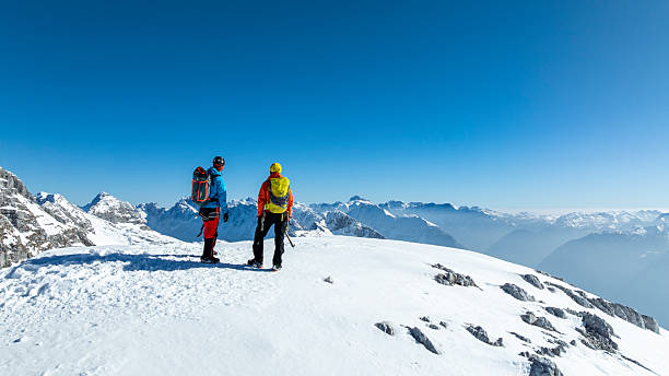 istock Adventurers Enjoying Scenic View at Mountain Summit 2235714182