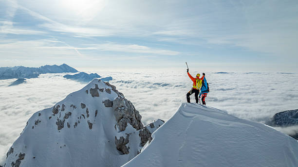 Experienced Mountaineers Celebrating at Mountain Summit