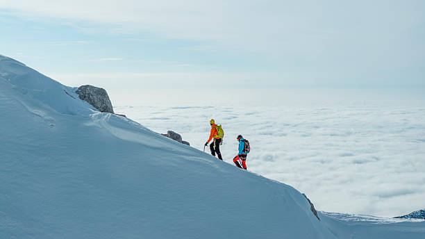 Adventurers Trekking Along Snow-covered Ridge