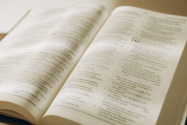 istock Open Holy Bible in English language, closeup 2235714256