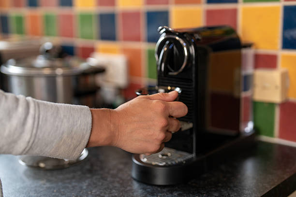 istock Brewing coffee with a machine in a colorful kitchen during morning hours 2235714535