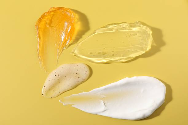 istock Samples of different cosmetic products on yellow background, above view 2235716397
