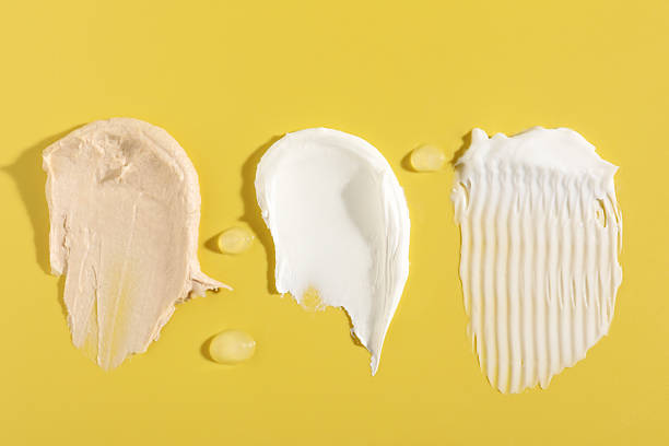 istock Samples of different cosmetic products on yellow background, flat lay 2235716631
