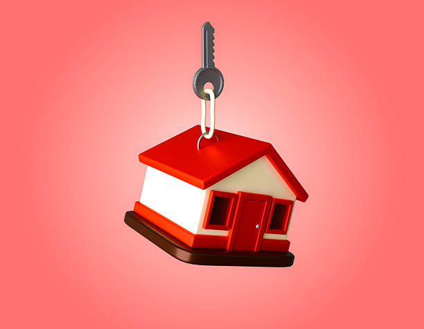 istock A house-shaped keychain with a key attached is depicted against a red background 2235717453