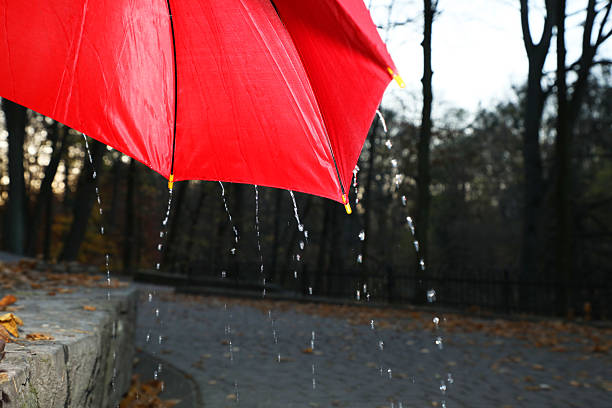 Raindrops background. Close up. Ice cold,  Red surface covered with water drops condensation texture. 