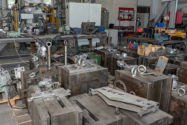 istock Workshop with industrial equipment and metal components on tables. 2235723725
