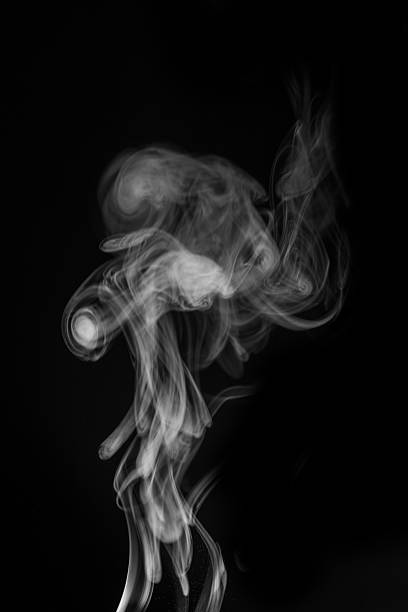 istock Ethereal smoke swirling gracefully in the air creating abstract shapes and patterns for artistic expression concept. graphic resource for montage, overlay or texture 2235724582