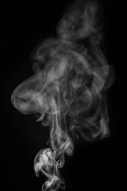 istock Ethereal smoke swirling gracefully in the air creating abstract shapes and patterns for artistic expression concept. graphic resource for montage, overlay or texture 2235724629