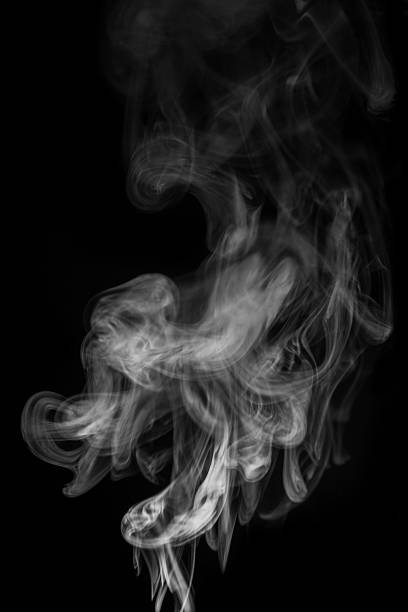 istock Ethereal smoke patterns swirling gracefully in the air creating a mesmerizing visual display of fluidity and movement concept. graphic resource for montage, overlay or texture 2235724636