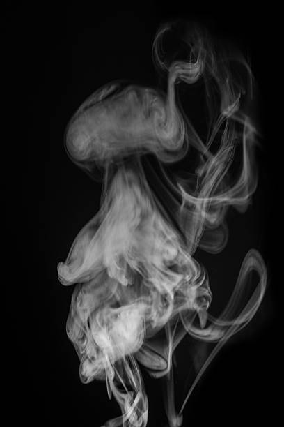 istock Ethereal smoke patterns swirling gracefully in the air creating a mesmerizing visual display of fluidity and movement concept. graphic resource for montage, overlay or texture 2235724644