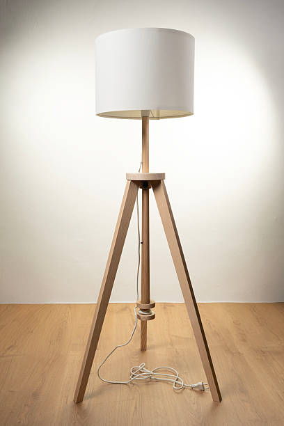 istock Elegant Wooden Floor Lamp with White Shade on Minimal Interior 2235725014