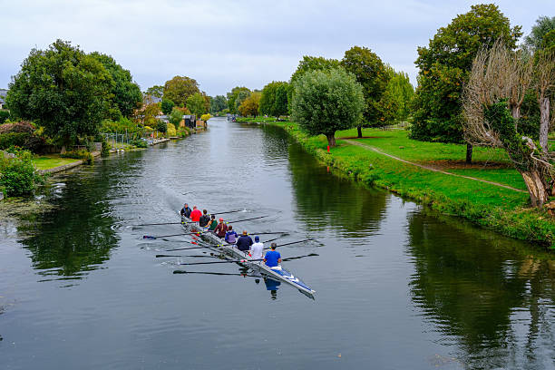 Eight oar rowing crews in a close race. 