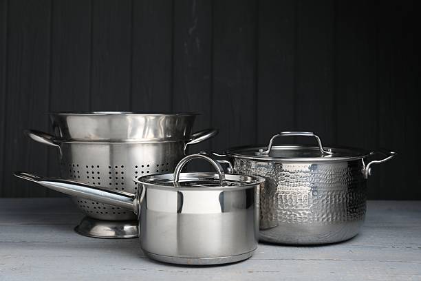 istock Stainless steel dishware on grey wooden table 2235726196