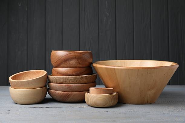 istock Wooden bowls on grey table. Cooking utensils 2235726222
