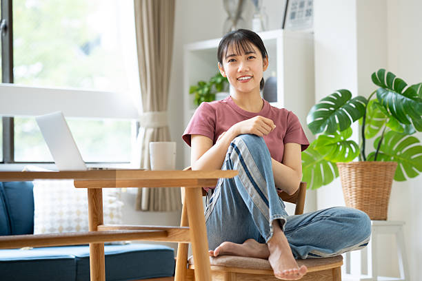istock Young woman relaxing at home 2235726290