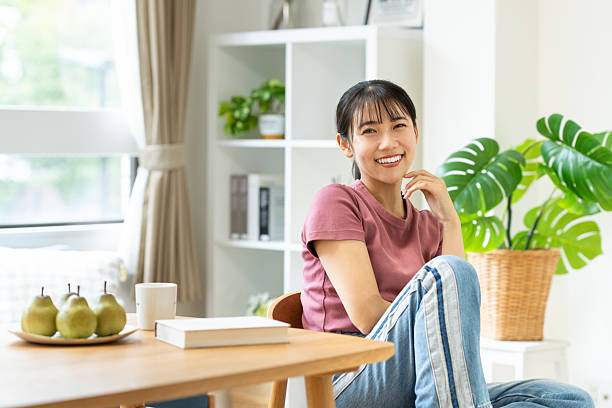 istock Young woman relaxing at home 2235726318