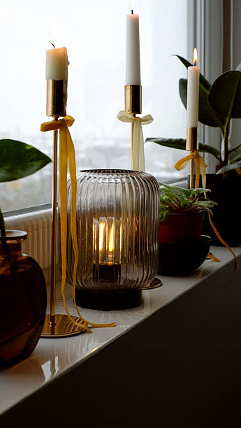 istock Christmas candlelight with golden holders and cozy home decor 2235730621